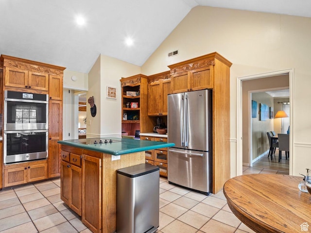 1728 E 27th St, Ogden, UT 84403 - kitchen featuring appliances with stainless steel finishes, a kitchen island, open shelves, light tile patterned floors, and brown cabinets