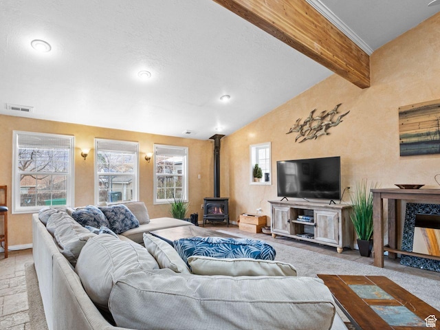 1728 E 27th St, Ogden, UT 84403 - carpeted living room featuring a wood stove and baseboards