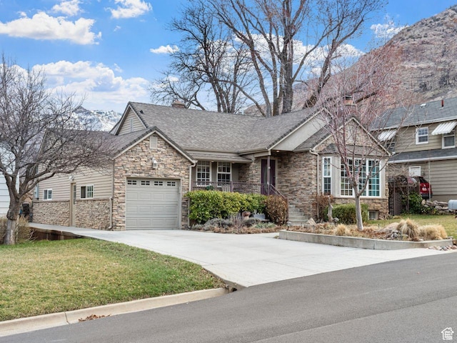 1728 E 27th St, Ogden, UT 84403 - view of front of house featuring stone siding, concrete driveway, an attached garage, a front yard, and a shingled roof