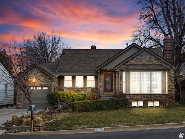 1728 E 27th St, Ogden, UT 84403 - view of front facade featuring stone siding, a chimney, driveway, an attached garage, and a front lawn