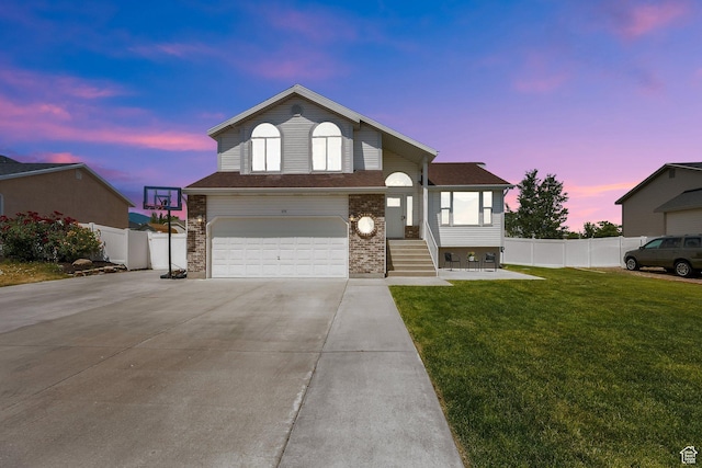 6470 S Wakefield Way, Salt Lake City, UT 84118 - view of front of property with driveway, a garage, and brick siding