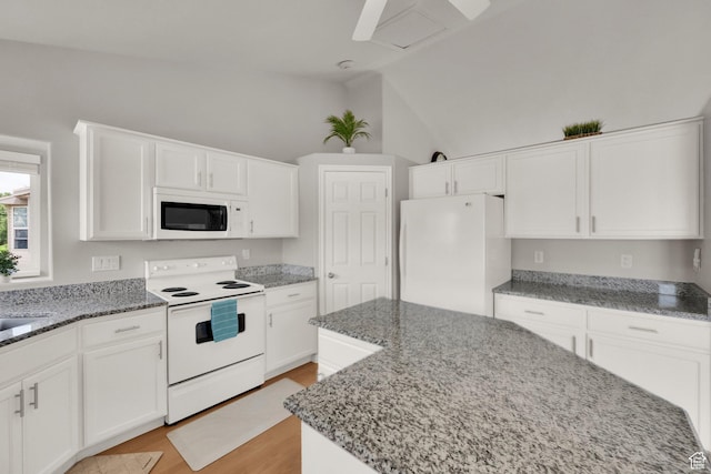 6470 S Wakefield Way, Salt Lake City, UT 84118 - kitchen with white appliances, stone countertops, light wood-style floors, white cabinetry, and vaulted ceiling