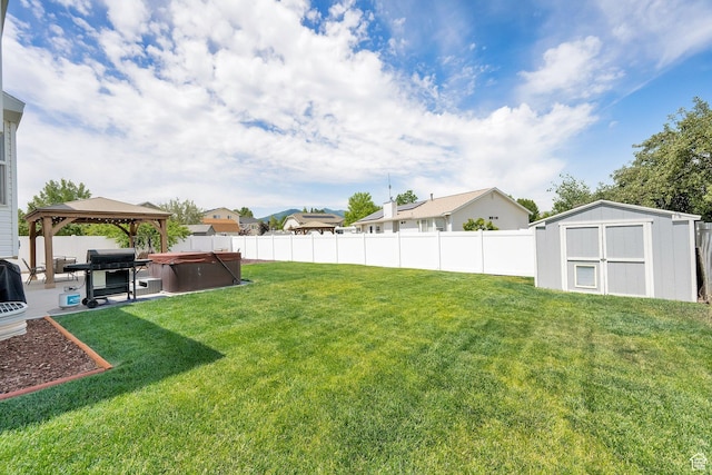 6470 S Wakefield Way, Salt Lake City, UT 84118 - fenced backyard with a hot tub, a storage unit, a patio, a gazebo, and a residential view
