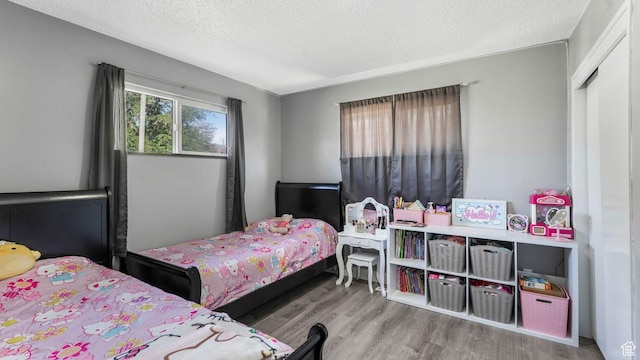 5356 S 4280 W, Salt Lake City, UT 84118 - bedroom featuring wood finished floors and a textured ceiling