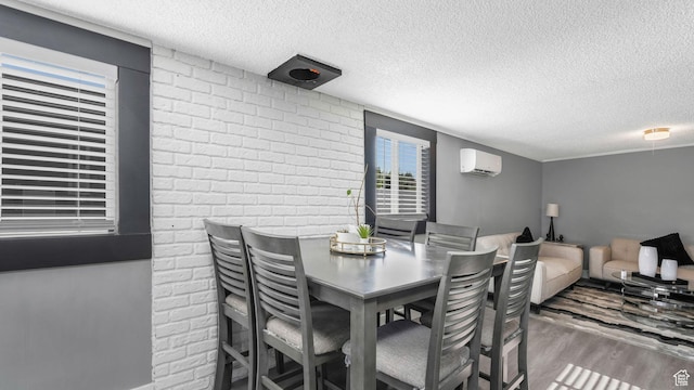 5356 S 4280 W, Salt Lake City, UT 84118 - dining room with an AC wall unit, wood finished floors, a textured ceiling, and brick wall