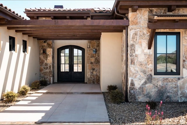 442 E Entrada Dr, Virgin, UT 84779 - property entrance with stone siding, french doors, a tiled roof, and stucco siding