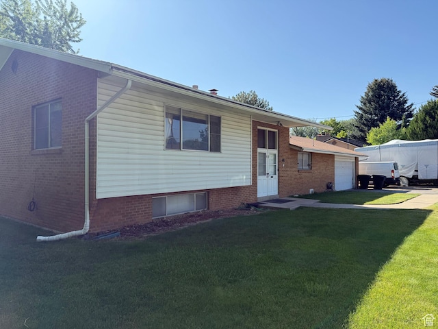 48 S Flint St, Kaysville, UT 84037 - tri-level home featuring a front yard, an attached garage, and driveway