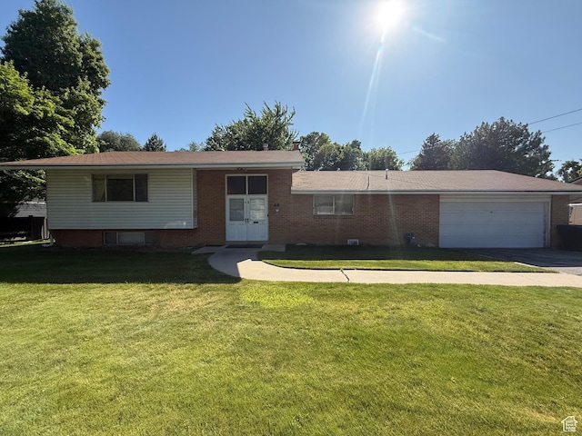 48 S Flint St, Kaysville, UT 84037 - view of front of property featuring an attached garage, concrete driveway, a front yard, and brick siding