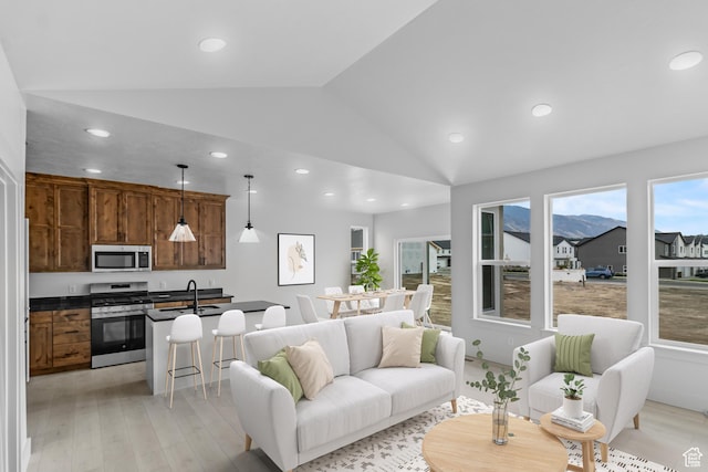 131 N 950 E Unit 35, Tremonton, UT 84337 - living area with vaulted ceiling, recessed lighting, and light wood-style flooring