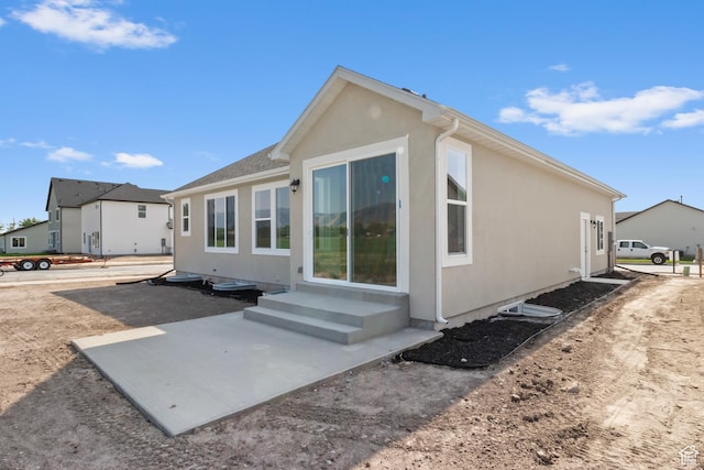 131 N 950 E Unit 35, Tremonton, UT 84337 - rear view of property featuring a patio and stucco siding