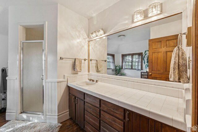 455 E Boulderville Rd, Oakley, UT 84055 - bathroom featuring wood finished floors, vanity, a stall shower, and a wainscoted wall