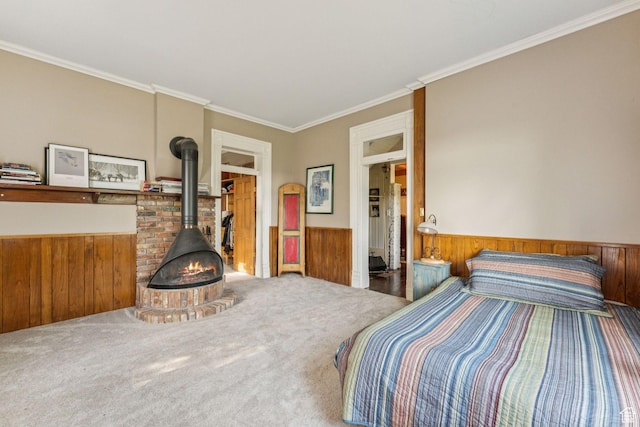 455 E Boulderville Rd, Oakley, UT 84055 - bedroom featuring a wood stove, wainscoting, crown molding, wood walls, and carpet flooring