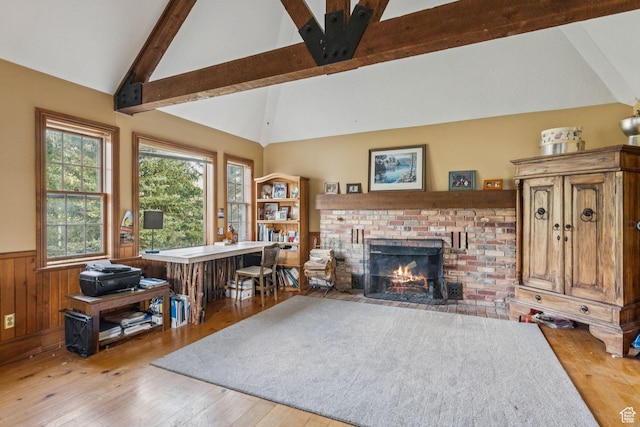 455 E Boulderville Rd, Oakley, UT 84055 - living room with a wainscoted wall, hardwood / wood-style flooring, a fireplace, beamed ceiling, and high vaulted ceiling