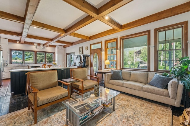 455 E Boulderville Rd, Oakley, UT 84055 - living room featuring coffered ceiling, beam ceiling, a chandelier, and dark wood-style flooring