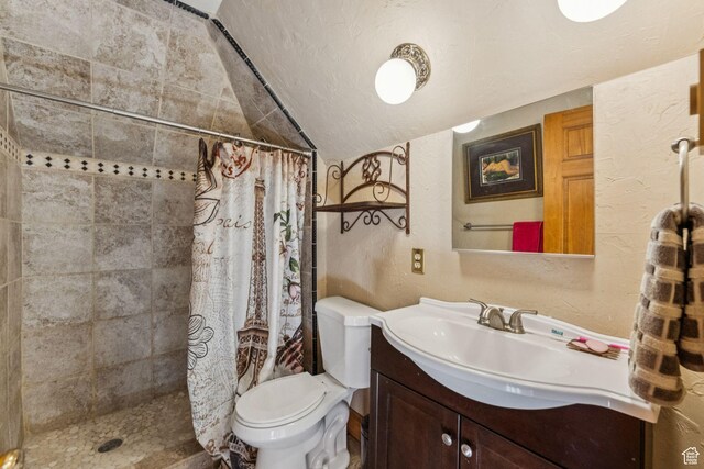 455 E Boulderville Rd, Oakley, UT 84055 - full bath with a textured wall, vaulted ceiling, vanity, a tile shower, and a textured ceiling