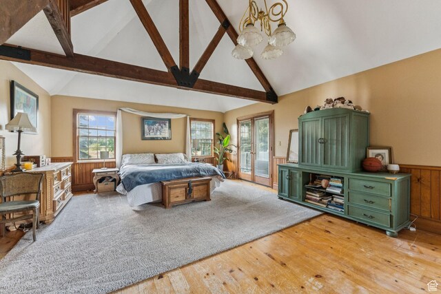 455 E Boulderville Rd, Oakley, UT 84055 - bedroom with a chandelier, access to exterior, light wood-type flooring, multiple windows, and wainscoting
