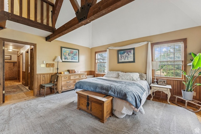 455 E Boulderville Rd, Oakley, UT 84055 - carpeted bedroom with a wainscoted wall, wood walls, high vaulted ceiling, and beamed ceiling