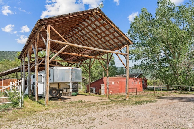 455 E Boulderville Rd, Oakley, UT 84055 - view of car parking with a detached carport and dirt driveway