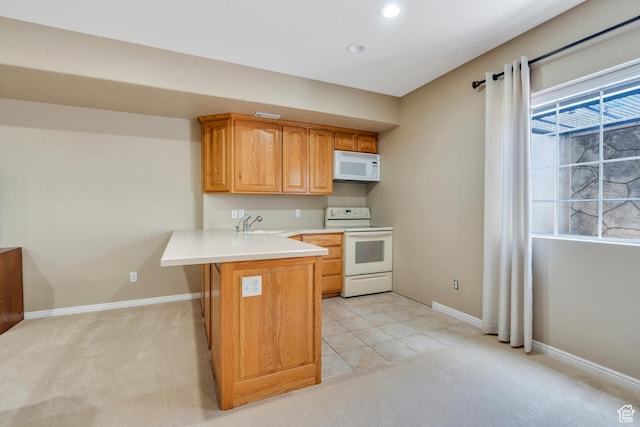 1125 E 740 S, Pleasant Grove, UT 84062 - kitchen with white appliances, a peninsula, light countertops, light carpet, and recessed lighting