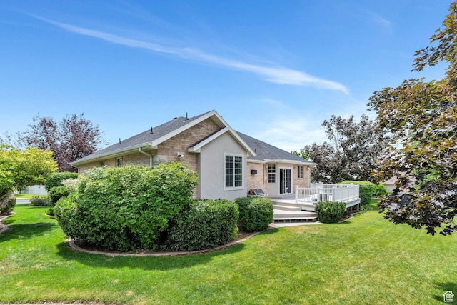 1125 E 740 S, Pleasant Grove, UT 84062 - view of front of property featuring a wooden deck, a front yard, and brick siding