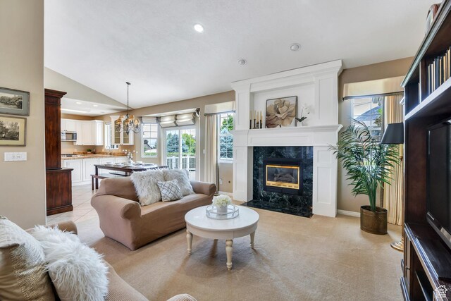 1125 E 740 S, Pleasant Grove, UT 84062 - living area with a high end fireplace, plenty of natural light, lofted ceiling, recessed lighting, and a chandelier