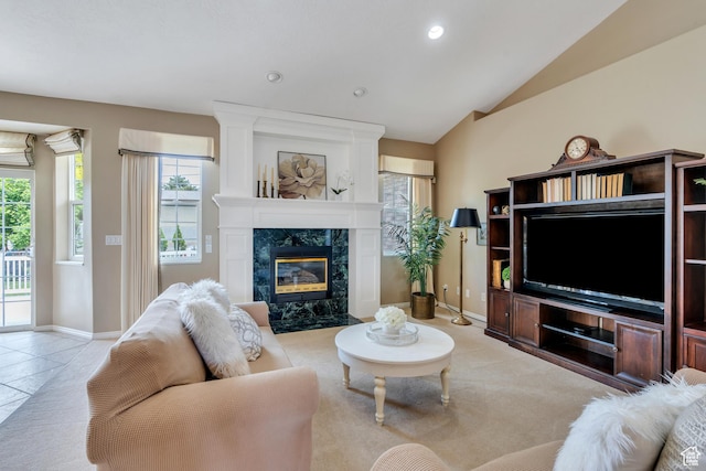 1125 E 740 S, Pleasant Grove, UT 84062 - living area featuring healthy amount of natural light, a high end fireplace, vaulted ceiling, recessed lighting, and light tile patterned floors