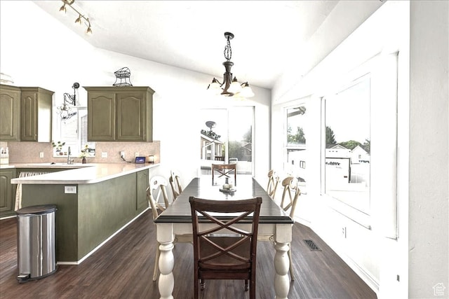 14133 S Lowe Peak Cir, Riverton, UT 84096 - dining space with a chandelier, dark wood-style flooring, and plenty of natural light