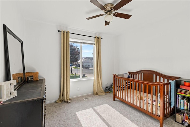 14133 S Lowe Peak Cir, Riverton, UT 84096 - bedroom with carpet floors, a crib, and a ceiling fan