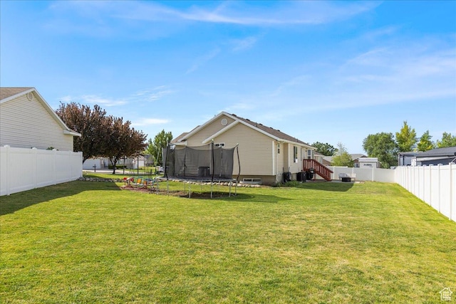 14133 S Lowe Peak Cir, Riverton, UT 84096 - fenced backyard with a trampoline