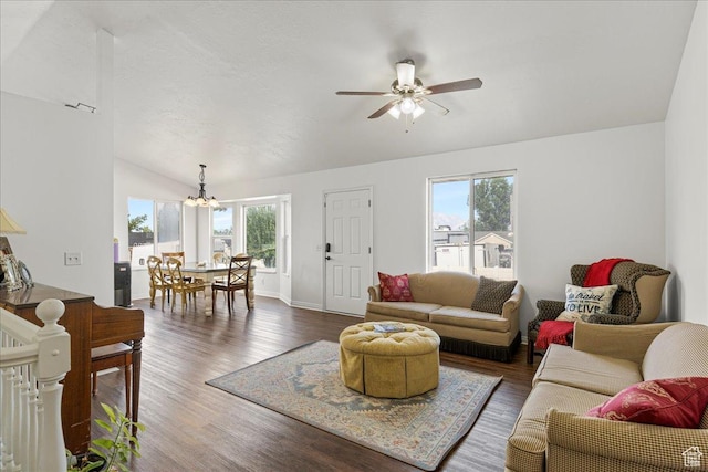 14133 S Lowe Peak Cir, Riverton, UT 84096 - living room featuring plenty of natural light, vaulted ceiling, a chandelier, ceiling fan, and dark wood finished floors