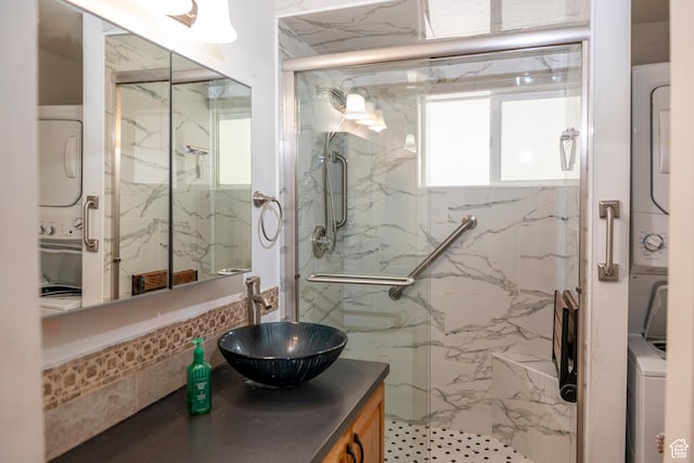 6867 S 1520 W, West Jordan, UT 84084 - bathroom featuring estacked washer and dryer, a marble finish shower, and vanity