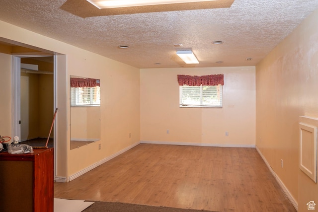 6867 S 1520 W, West Jordan, UT 84084 - spare room with a textured ceiling, light wood-style flooring, and plenty of natural light