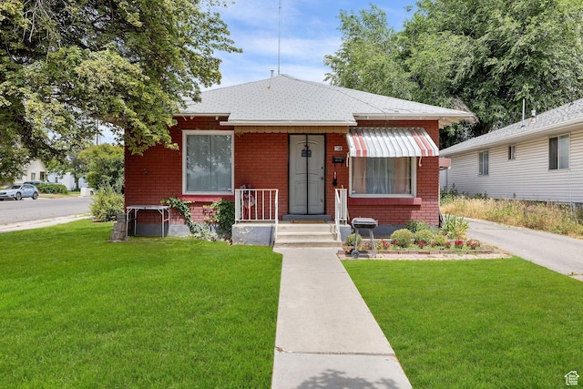 792 W 100 N, Provo, UT 84601 - bungalow-style home featuring a front lawn and brick siding