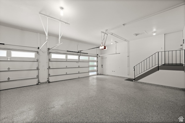 4504 S Abinadi Rd E, Millcreek, UT 84124 - garage featuring a garage door opener