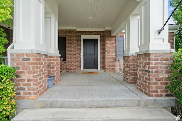 855 E Snap Dragon Ln, Fruit Heights, UT 84037 - property entrance featuring brick siding and covered porch