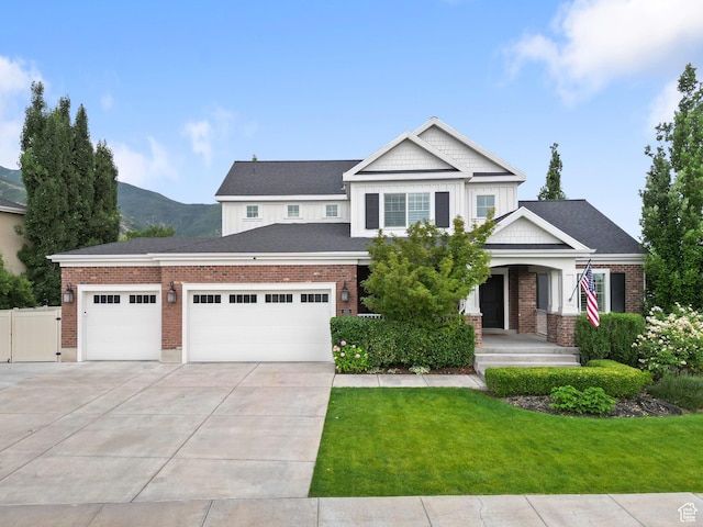 855 E Snap Dragon Ln, Fruit Heights, UT 84037 - craftsman-style home featuring an attached garage, driveway, brick siding, a porch, and board and batten siding