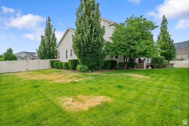 855 E Snap Dragon Ln, Fruit Heights, UT 84037 - fenced backyard with a gate and a wooden deck