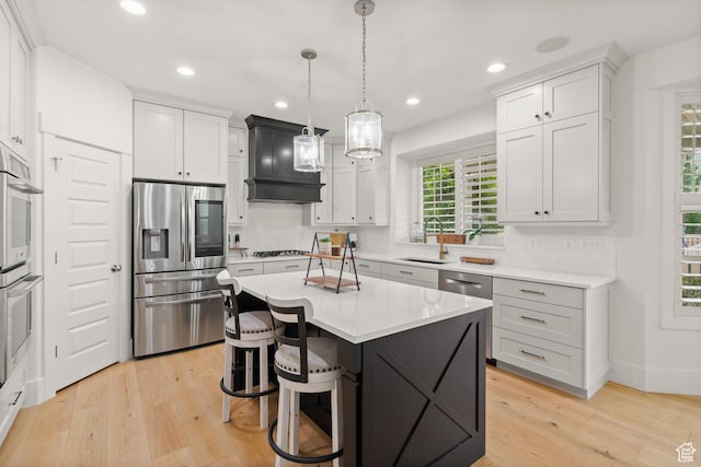 855 E Snap Dragon Ln, Fruit Heights, UT 84037 - kitchen with appliances with stainless steel finishes, light wood-style flooring, tasteful backsplash, light countertops, and recessed lighting
