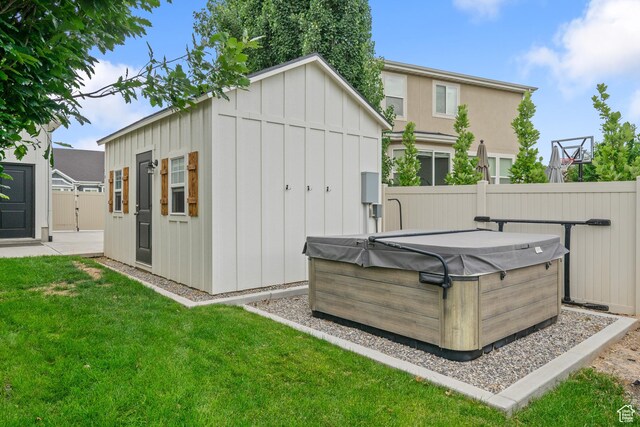 855 E Snap Dragon Ln, Fruit Heights, UT 84037 - rear view of house with a hot tub, board and batten siding, and a storage shed