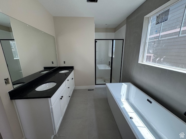 835 S 950 W Unit 124, Springville, UT 84663 - bathroom featuring a tub, double vanity, a stall shower, and tile patterned floors