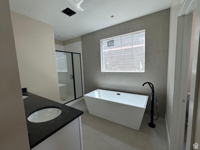 835 S 950 W Unit 124, Springville, UT 84663 - full bathroom with double vanity, a stall shower, a soaking tub, and tile patterned floors