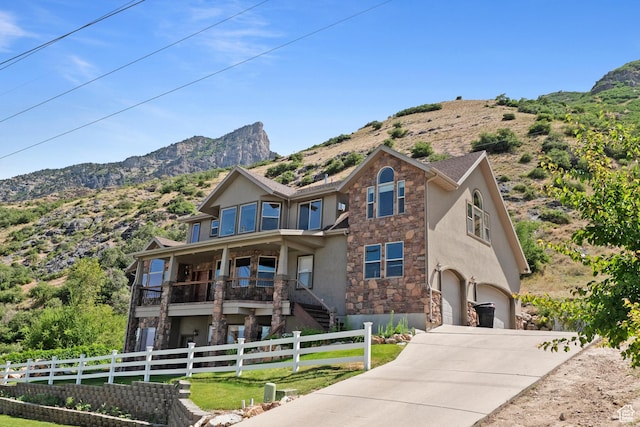 1922 N 1550 E, Provo, UT 84604 - view of front of home featuring stone siding, stucco siding, a garage, and concrete driveway