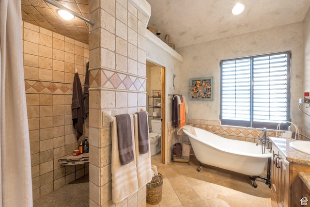 11273 S Alisa Meadows Dr, South Jordan, UT 84095 - full bathroom with tile walls, vanity, a freestanding tub, tiled shower, and tile patterned flooring