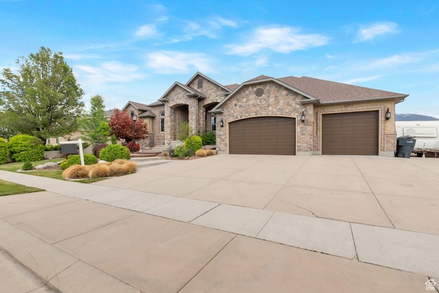 11273 S Alisa Meadows Dr, South Jordan, UT 84095 - french provincial home with an attached garage, concrete driveway, and stone siding