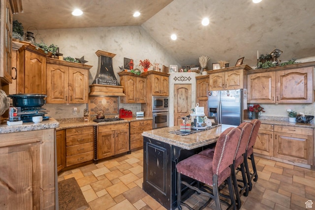 11273 S Alisa Meadows Dr, South Jordan, UT 84095 - kitchen featuring stainless steel appliances, premium range hood, high vaulted ceiling, light stone finish flooring, and a center island