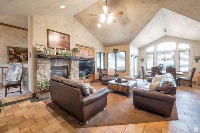 11273 S Alisa Meadows Dr, South Jordan, UT 84095 - living area with ceiling fan, a fireplace, stone tile flooring, a chandelier, and high vaulted ceiling
