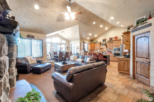 11273 S Alisa Meadows Dr, South Jordan, UT 84095 - living room with a ceiling fan, vaulted ceiling, light stone finish flooring, and recessed lighting