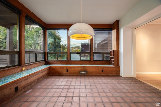 116 S University St E, Salt Lake City, UT 84102 - unfurnished sunroom with tile patterned floors and baseboards