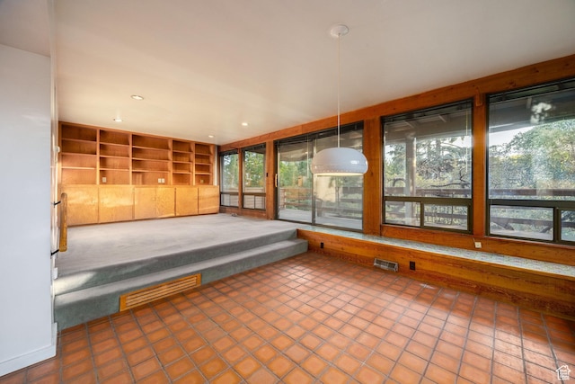 116 S University St E, Salt Lake City, UT 84102 - unfurnished sunroom featuring healthy amount of natural light, tile patterned flooring, and recessed lighting