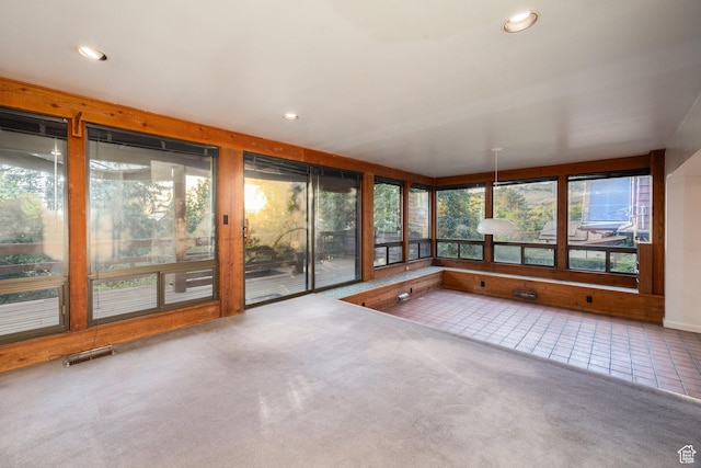 116 S University St E, Salt Lake City, UT 84102 - unfurnished sunroom featuring recessed lighting, carpet floors, and tile patterned floors